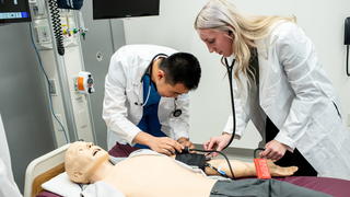 Nursing students at Saint Joseph's University practicing in a hospital setting.