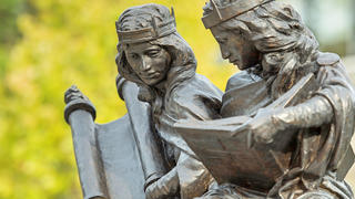 The bronze sculpture "Synagoga and Ecclesia in Our Time" by Joshua Koffman commemorates the 50th anniversary of Nostra Aetate, the Vatican II document that transformed the relationship between the Catholic and Jewish faiths. Located in the plaza at the Chapel of Saint Joseph, Pope Francis blessed the sculpture on Sept. 27, 2015, and its portrayal of Jews and Christians learning from each other's sacred texts.