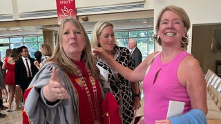Dr. McConnell, and a patron at a ceremony