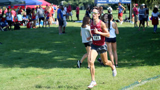Saint Joseph's University cross country team running on field at Lehigh Invitational