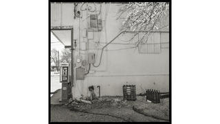 white wall with payphone