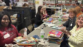 Picture of SJU employees serving at Cradles to Crayons