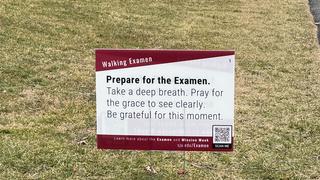 Walking Examen Signs outside