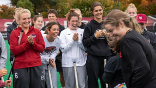 Saint Joseph's field hockey team gathered on field together