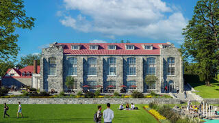 A large 5 story stone building that will house the new Kinney Center