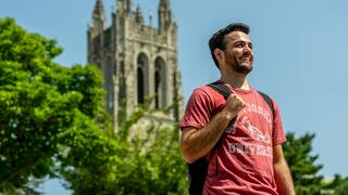 Student standing in front of building at St. Joe's