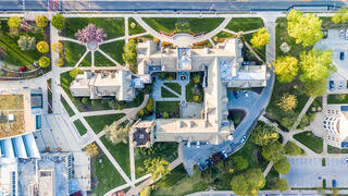 Aerial view showing a sprawling building and walkways on Hawk Hill