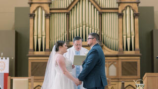 couple getting married holding hands