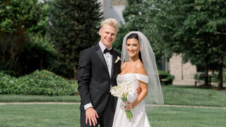 bride and groom in front of barbelin
