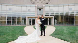 bride and groom in front of Chapel of St. Joseph