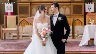 couple at wedding in front of altar