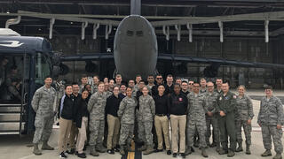 AFROTC officers standing in the back of open cargo jet