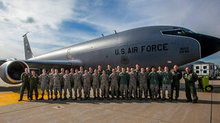 AFRTOC officers standing at the side of large transport jet