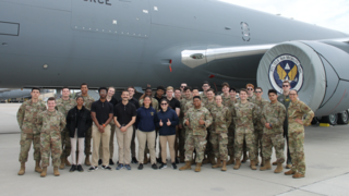 AFROTC standing at the side of large transport jet