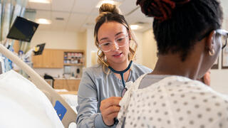 nurse examining patient