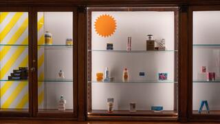 Gallery installation view showing historical artifacts and contemporary art. 