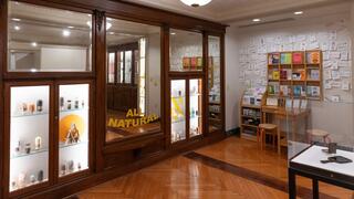 Rear gallery view with mirrors, cases, and zine library