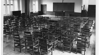 empty classroom in barbelin hall filled with empty desks
