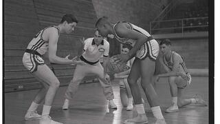 Jack Ramsay instructing players on how to play basketball, 1960.