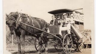 two student in a horse-drawn cart circa 1939