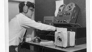 student adjusting very old fashioned radio equipment, 1968.