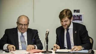 Joe DiAngelo signing UN document