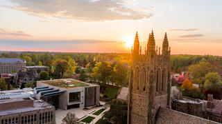 aerial shot of saint joseph's university with the sun setting in the background