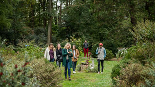 students walking outside the barnes arboretum grounds