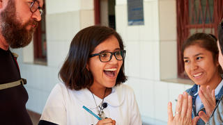 a young girl interviewing a woman