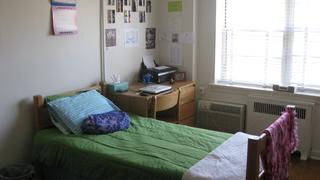 a bedroom inside merion gardens apartments in philadephia, pa
