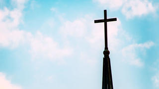 cross against a blue sky