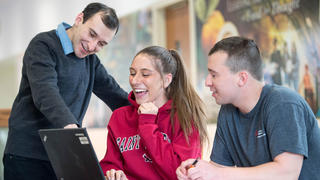 food marketing professor talking to two saint joseph's university students