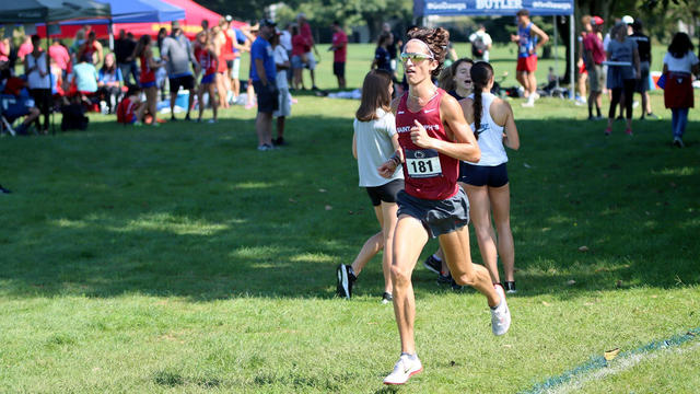 Saint Joseph's University cross country team running on field at Lehigh Invitational