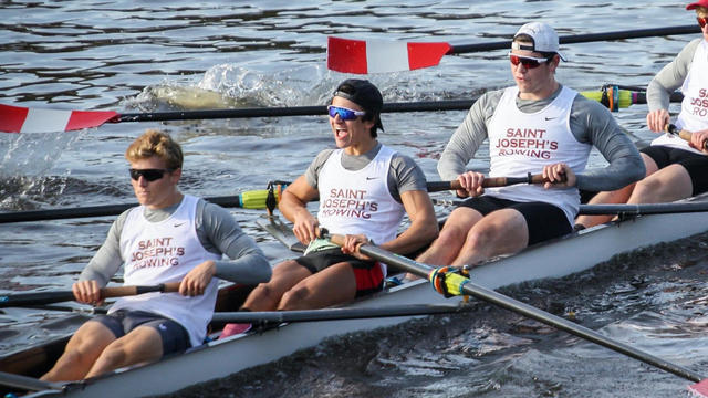 Members of the Saint Joseph's men's rowing team rowing on the water
