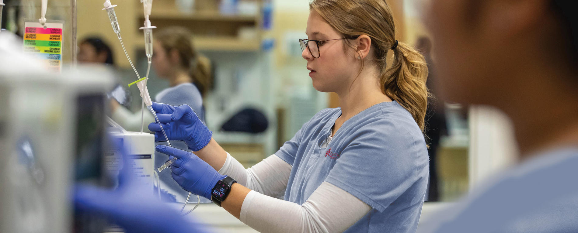 Saint Joseph's University nursing student putting oxygen on a simulation lab