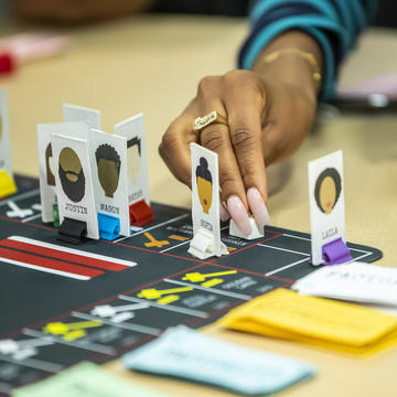Member of the Saint Joseph's community participating in playing the Factuality game.