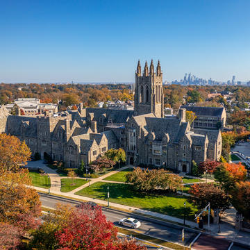 Aerial view of Saint Joseph's University campus with Philadelphia skyline in the background