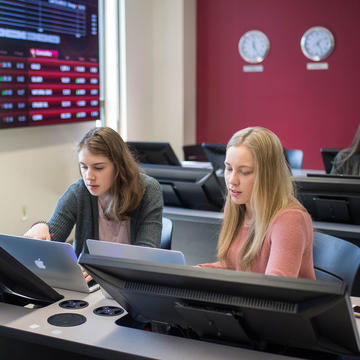 two Saint Joseph's students in the Wall Street Trading Room