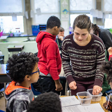 a student teacher inside a classroom with students