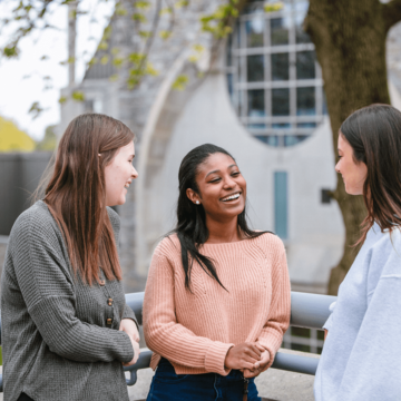 Undergraduate students hang out outside Saint joseph's chapel