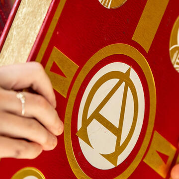 person holding religious book at mass of the holy spirit
