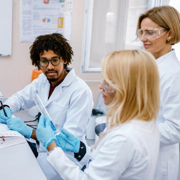 Three people working in a lab