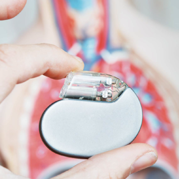 Closeup of a hand holding a defibrillator