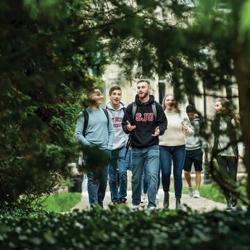Student walking outside of Barbelin hall