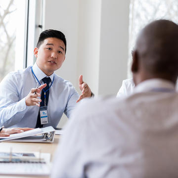 Healthcare business professionals talking in a meeting room