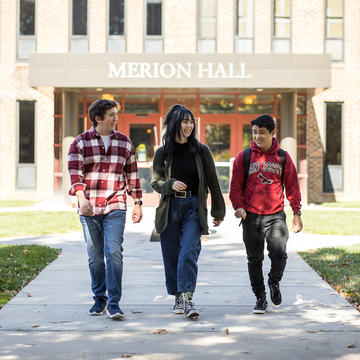 Three Saint Josephs students walking outside of Merion Hall