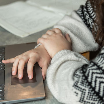 Student researching on laptop
