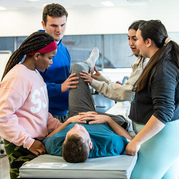 Saint Joseph's Physical Therapy students in simulation lab working with peers