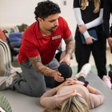 Physical therapy student in clinical rotation working with patients