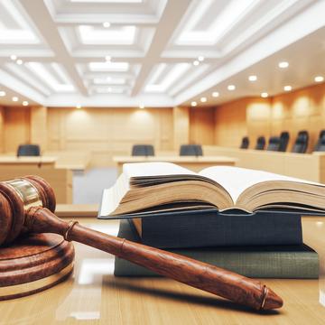 Courtroom with a gavel and open book on a table